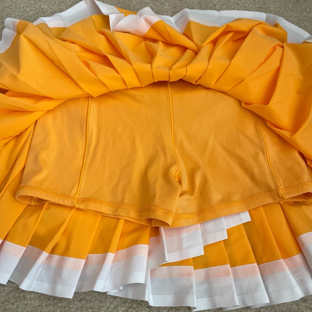 Aerie Offline Pleated Orange Skirt with White Trim and Built-in shorts - Picture 6 of 7